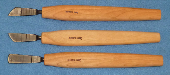 The three bullnose chisels - right skew, left skew, and straight, top view
